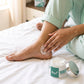 Woman applying Fleuré Feet Crack Cream on heel for daily foot care ritual